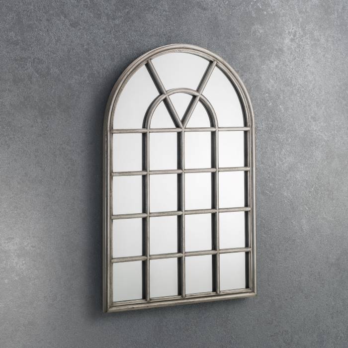 Opus window mirror placed on a a wall