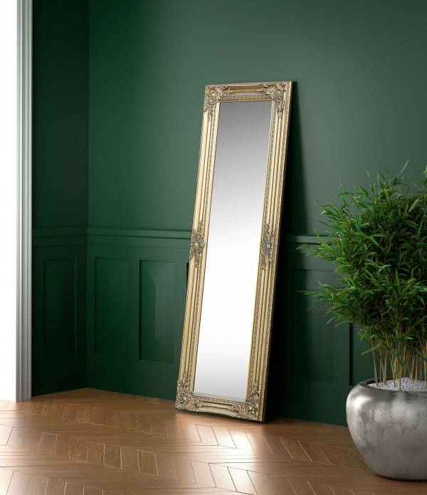 Palais gold dree mirror placed in a room