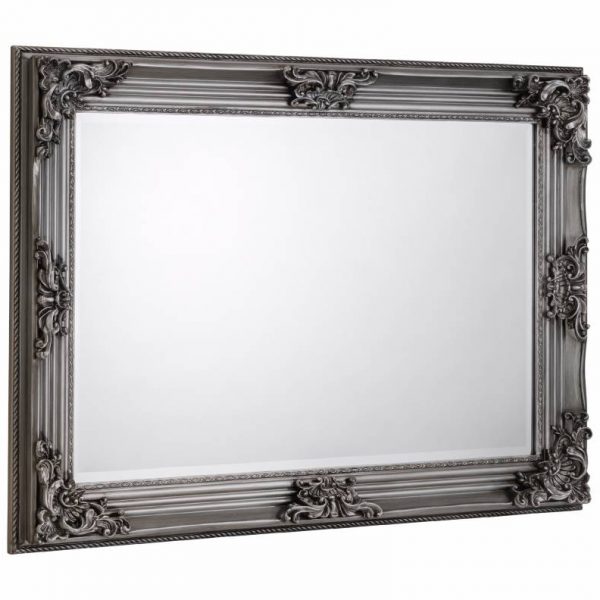 Rococo wall mirror placed on a white background